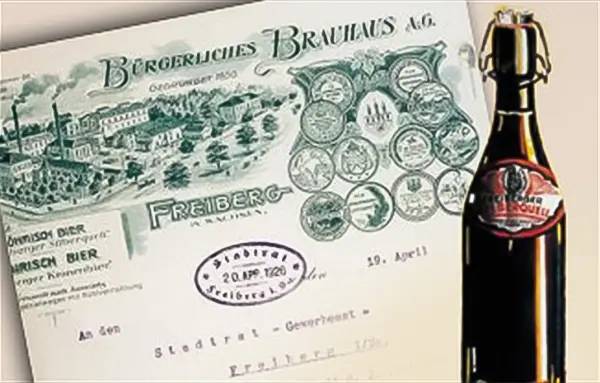 Eine alte Aktienurkunde liegt neben einer Bierflasche mit Bügelverschluss.