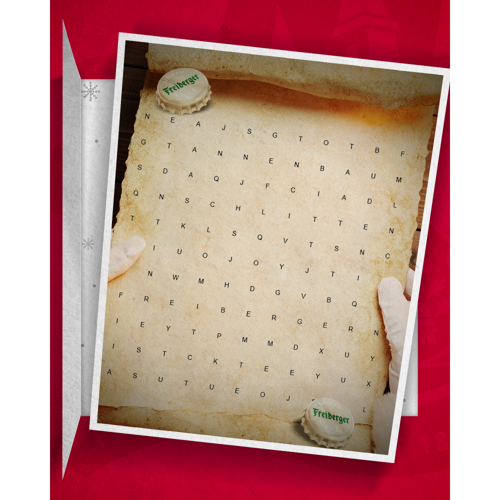 Suchspiel auf einem Blatt mit verschiedenen Buchstaben, wird von 2 Händen gehalten. Oben links und unten rechts liegt jeweils ein Freiberger Kronkorken.